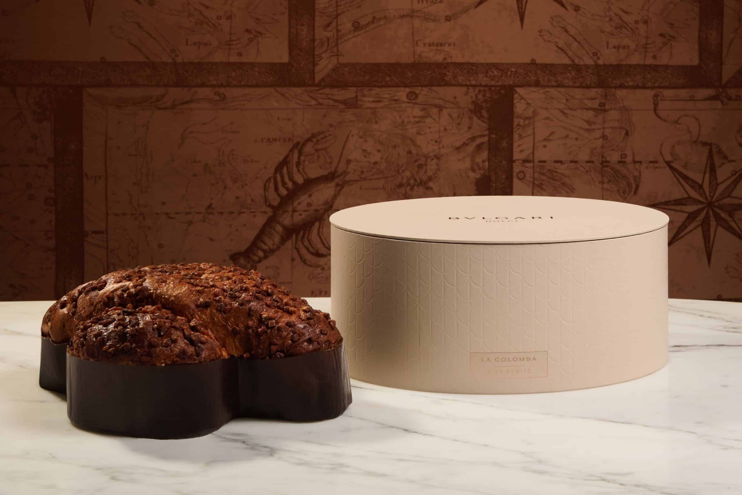 Bulgari Easter 2026 Niko Romito La Colomba cake with luxury cream-colored branded packaging on marble