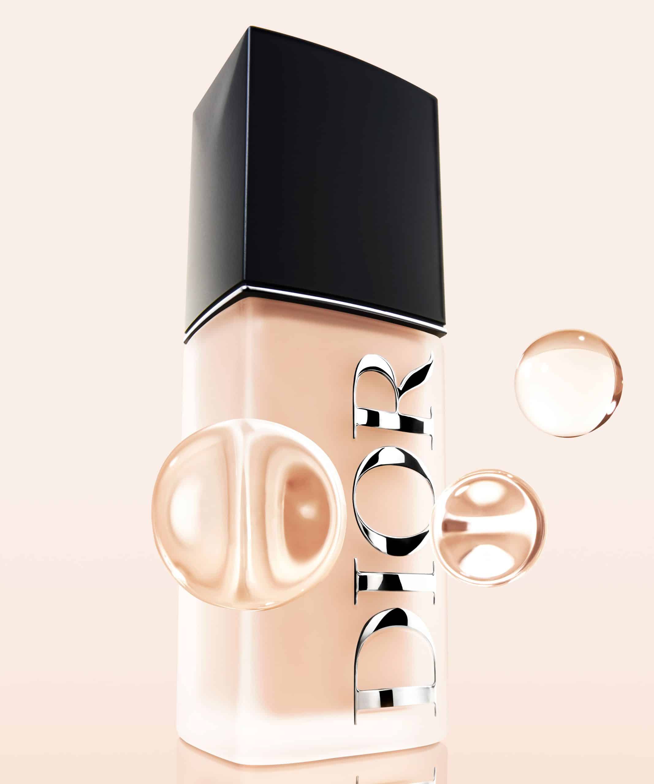 Dior Forever Skin Glow foundation bottle in shade with luxury branding and liquid drop on a neutral background