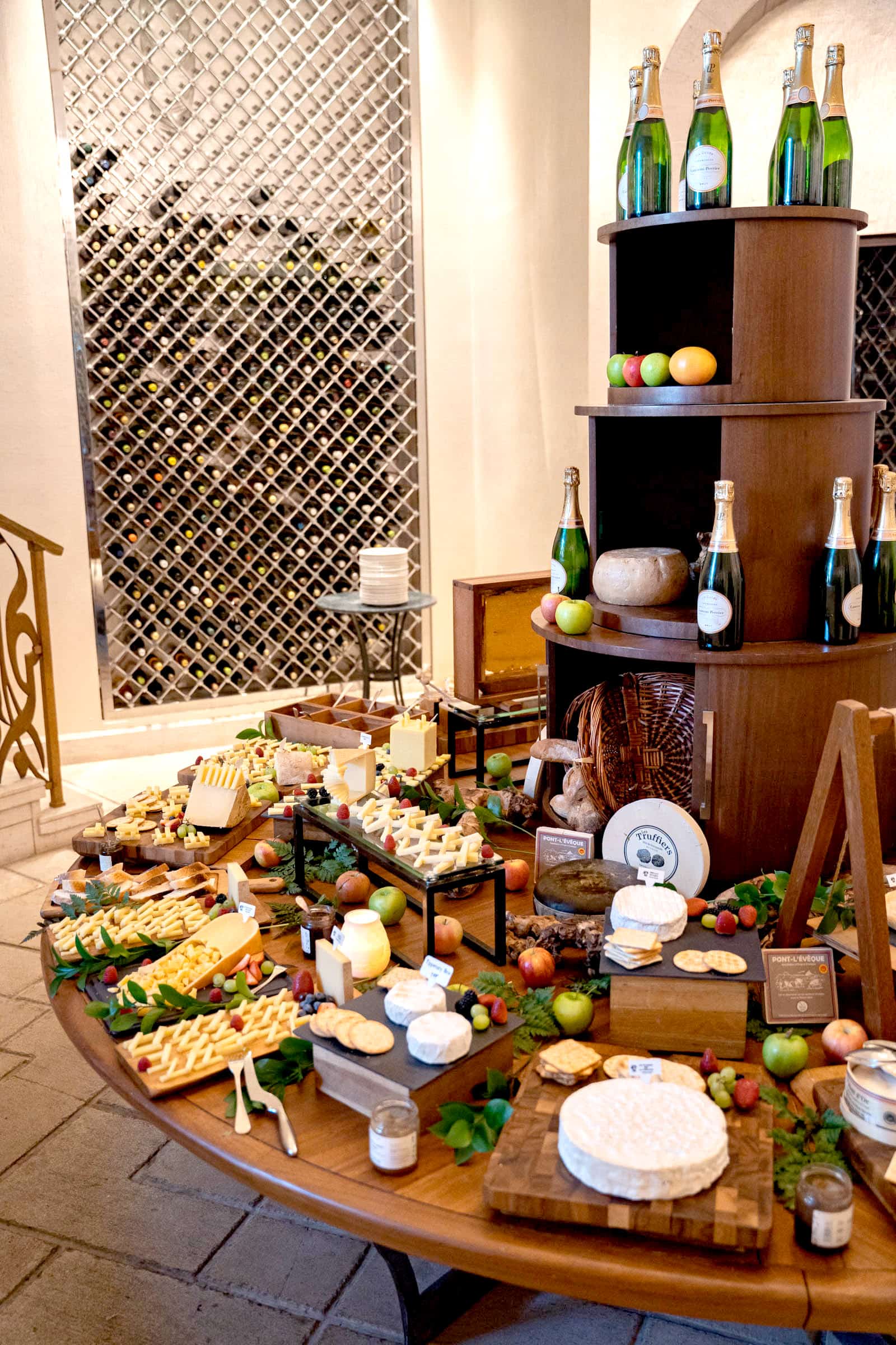 A decadent Easter brunch at Traiteur Brunch Dubai Creek Resort with cheese display featuring an extensive gourmet selection of French cheeses, honeycomb, fruits, and for the Sorbet Easter Guide.